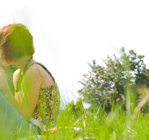 woman field offscreen green
